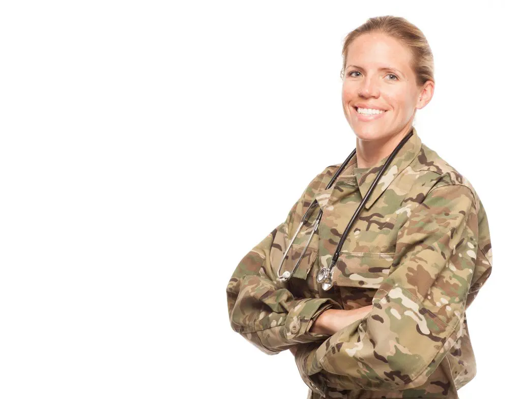 A headshot of a female military doctor wearing a stethoscope around her neck.