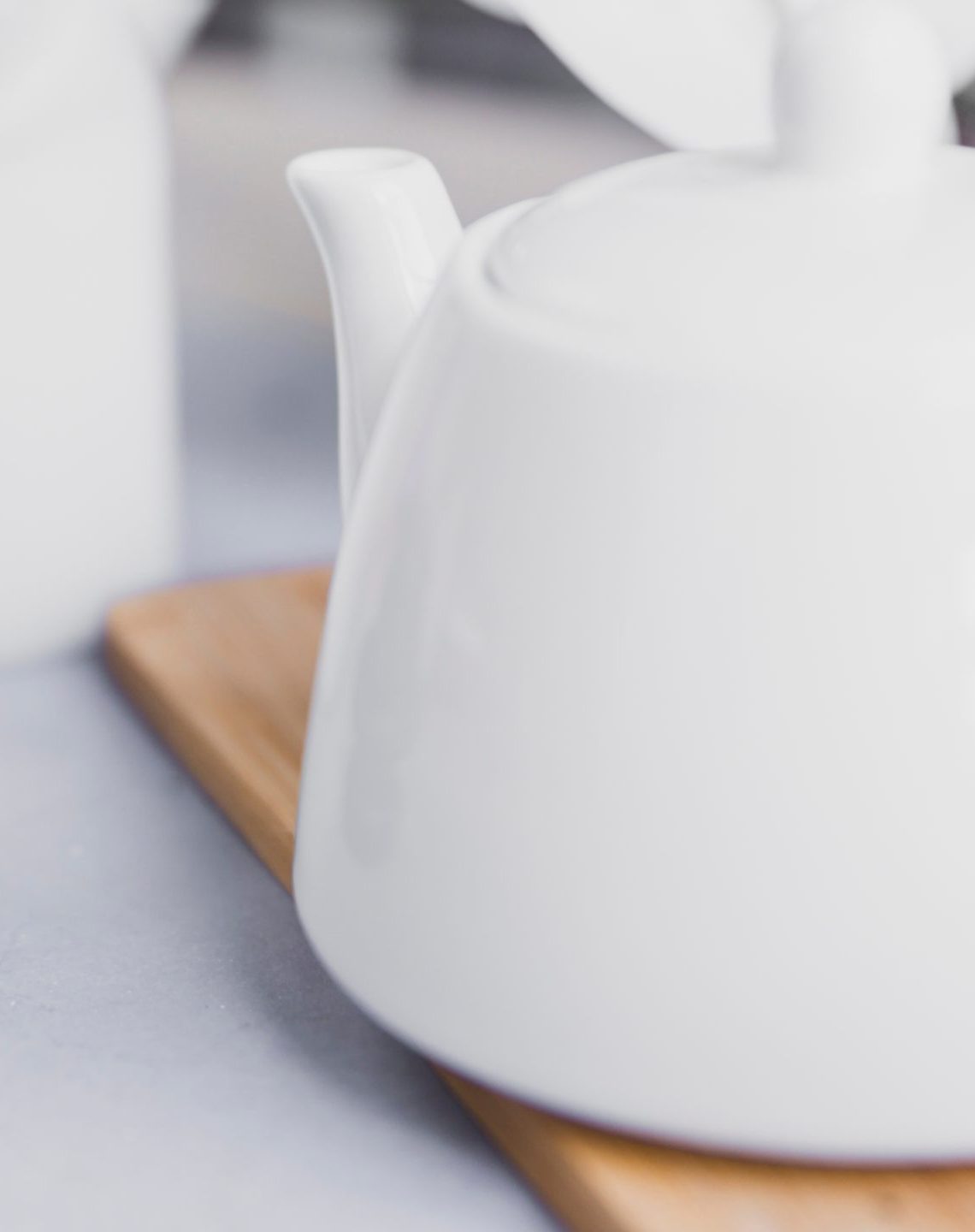 stacked stones and a white coffee pot